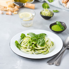 Seasonal zucchini spaghetti pasta noodles with spinach pesto sauce