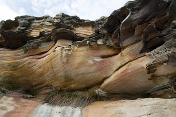 Sydney Australia, looking up at sandstone cliff