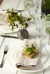 Festive spring table setting with pear blossom flowers