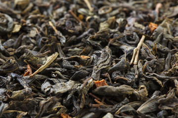 A mixture of dry green large-leaf tea with soursop