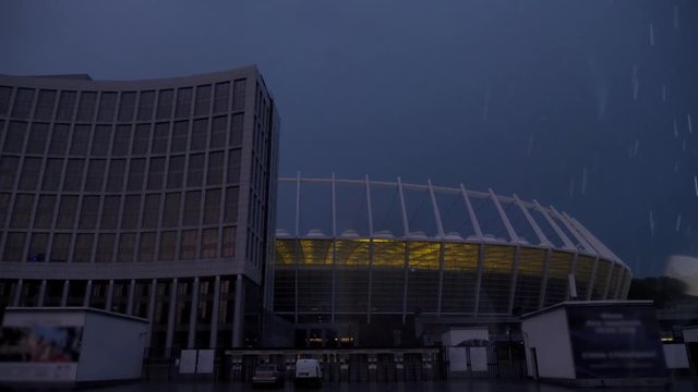 Bad weather, rain, rain, evening city, football stadium, thunderstorm, lightning concept. 50 fps