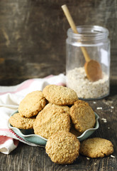 Homemade oatmeal cookies on wooden table.