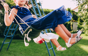 two girls dresses sandals swing motion