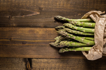 Bunch of Fresh Green Asparagus in Paper Bag. Copy Space.