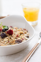 Sunny Morning with Healthy Breakfast. Muesli With Milk, Chia Seeds, Berries and Cinnamon.