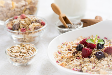 Sunny Morning with Healthy Breakfast. Muesli With Milk, Chia Seeds, Berries and Cinnamon.