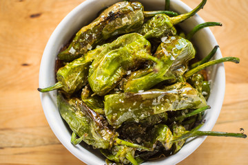 Pimientos de Padron. Padron Green Peppers in White Bowl.