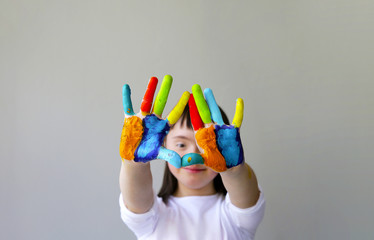 Cute little girl with painted hands. - 205088157