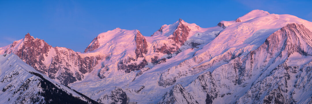 Mont Blanc mountain range at sunset in Upper Savoy. From left to right, Aiguille du Midi needle, Mont Blanc du Tacul, Mont Maudit, Mont Blanc and Dome du Gouter. Chamonix, Haute-Savoie, Alps, France