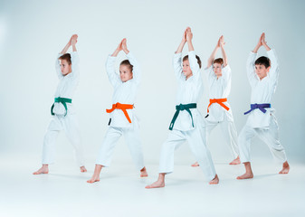 The group of boys and girl fighting at Aikido training in martial arts school. Healthy lifestyle and sports concept