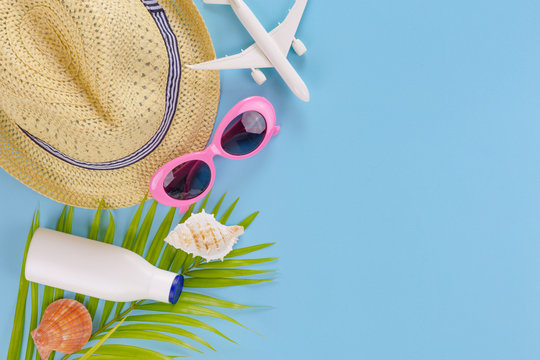 summer set top view,outfit and accessories of traveler on blue  background with copy space, Travel concept.Overhead view of Traveler's accessories, Essential vacation items,