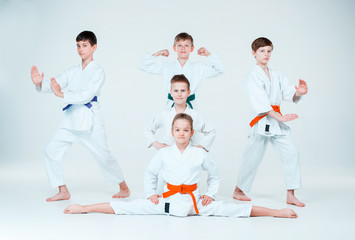 The group of boys and girl fighting at Aikido training in martial arts school. Healthy lifestyle and sports concept