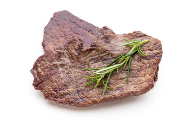 Grilled beef steaks with spices isolated on white background.