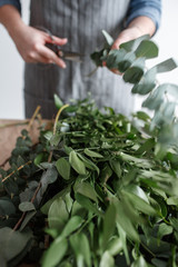 Florist makes a bouquet. Process of work
