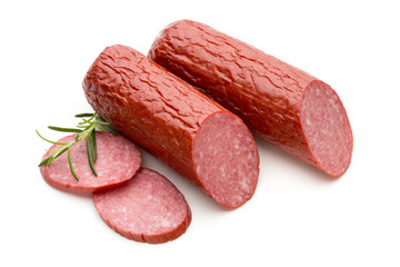 Salami smoked sausage, basil leaves on white background cutout.
