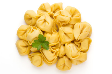 Raw homemade pasta,tortellini with herbs.