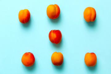 Apricots set of six  isolated over a blue background viewed from above, flatlay style