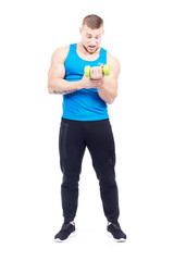 Athletic man performing dumbbell exercise on white background