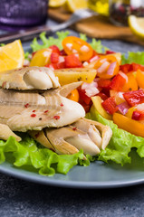 Fish fillet with raw vegetables