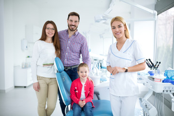 Dentist with sterile mask and dental instruments held exam teeth of patient