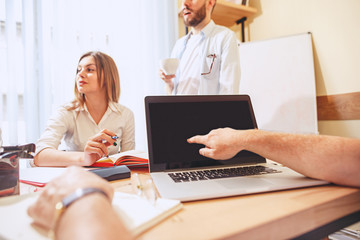 Team job. Photo young businessmans working with new project in office