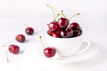 Fresh and Beautiful Cherry in a White Cup Ripe Juicy Cherry Close Up White Background