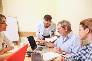 Obraz premium Team job. Photo young businessmans working with new project in office