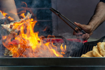 Fototapeta premium Barbecue grill fire with hands