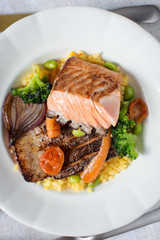 Grilled Salmon Steak with Vegetables on White Plate. Healthy Food.