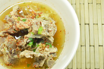 spicy boiled pork rib dressing cayenne pepper soup on bowl