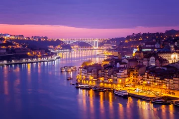 Foto op Canvas Porto, Portugal old city skyline from across the Douro River, beautiful urban landscape, a popular destination for travel to Europe © olezzo