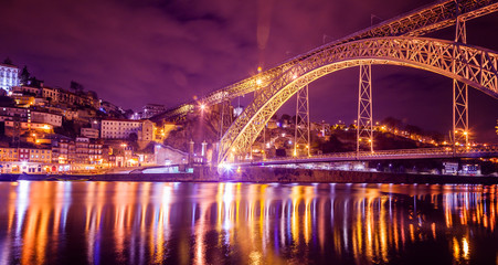 Fototapeta na wymiar Dom Luis Bridge illuminated at night. Porto, Portugal western Europe