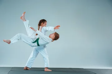 Fotobehang The boy fighting at Aikido training in martial arts school. Healthy lifestyle and sports concept © master1305