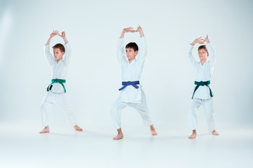 The group of boys fighting at Aikido training in martial arts school. Healthy lifestyle and sports concept