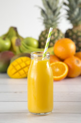 Tropical Fruit Smoothy on a White Wood Table