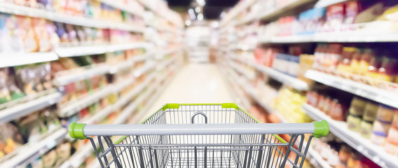 Abstract blur supermarket aisle with product on shelves defocused background