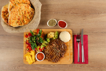 Delicious Beef Steak Meat on Wooden Restaurant Plate
