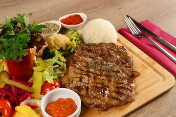 Delicious Beef Steak Meat on Wooden Restaurant Plate