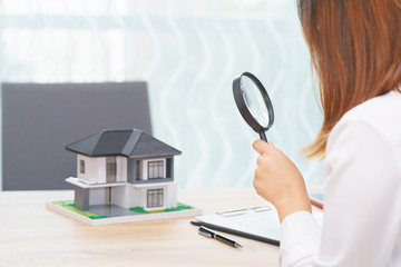 Smile woman searching for new home or inspecting homes before buying concept.