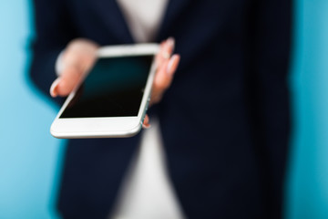 Female hand holding a phone