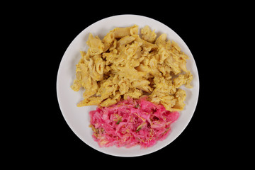 Whole-grain pasta with tofu on a black