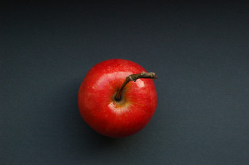 juicy red apple on a dark background