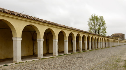 arches of santa Maria covered walkway on Mazzini street, Comacchio, Italy