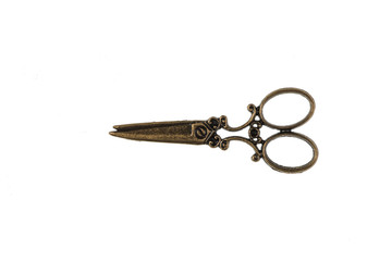vintage copper scissors on white background