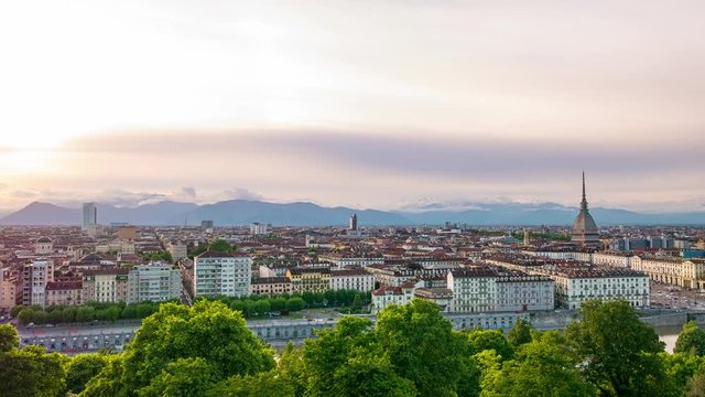 Turin time lapse, Italy, Torino skyline with the Mole Antonelliana and hot air baloon. Time lapse at sunset with motion clouds. 