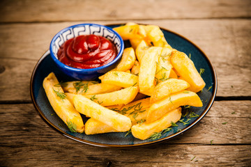 French fries on wooden table