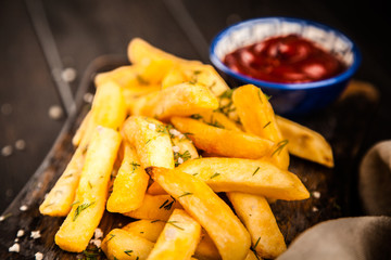 French fries on wooden table