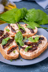 Bruschetta with cream cheese and dried tomato