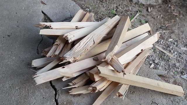 cutting wood logs with hatchet, man splitting firewood for winter