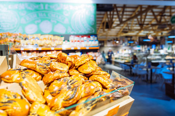 bakery shelf in store. grocery shopping. counter with bun